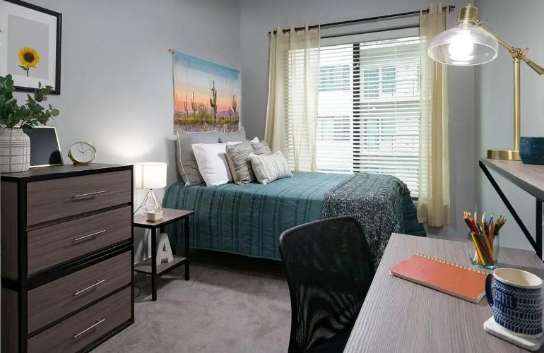 Bedroom with green sheets